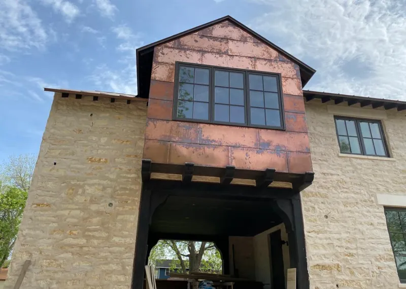 Copper metal panel facade on a stone building for Metal Roof Coating in North Whitehall